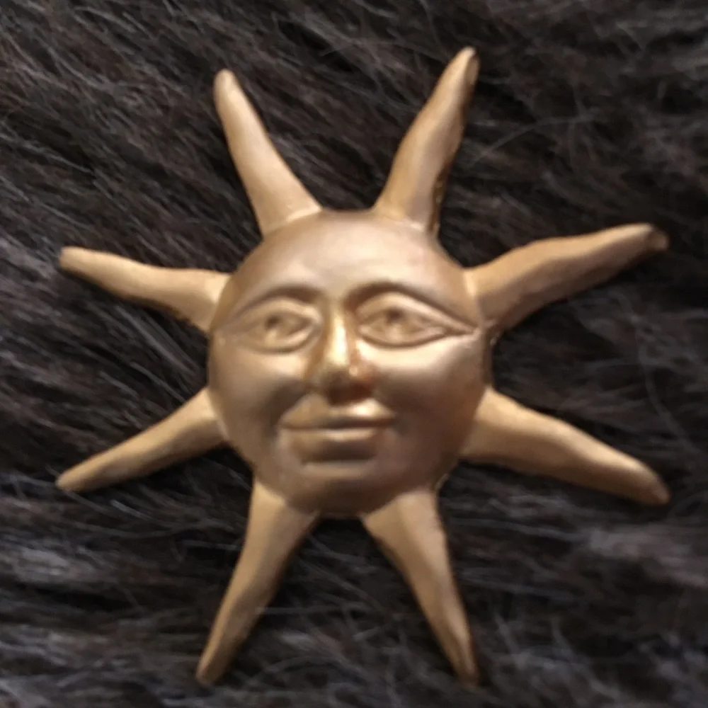 Vintage gold painted sun tac pin brooch